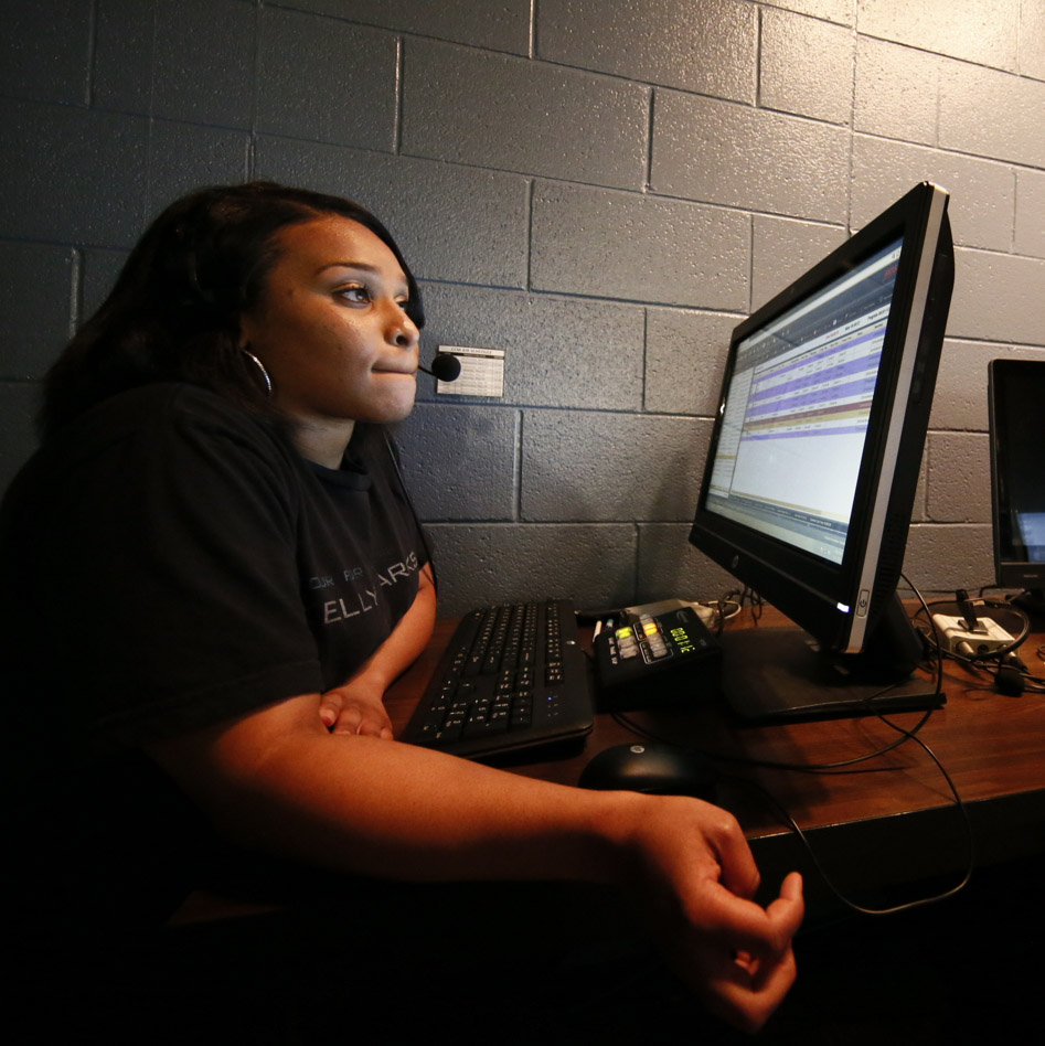 Student at computer with headset on